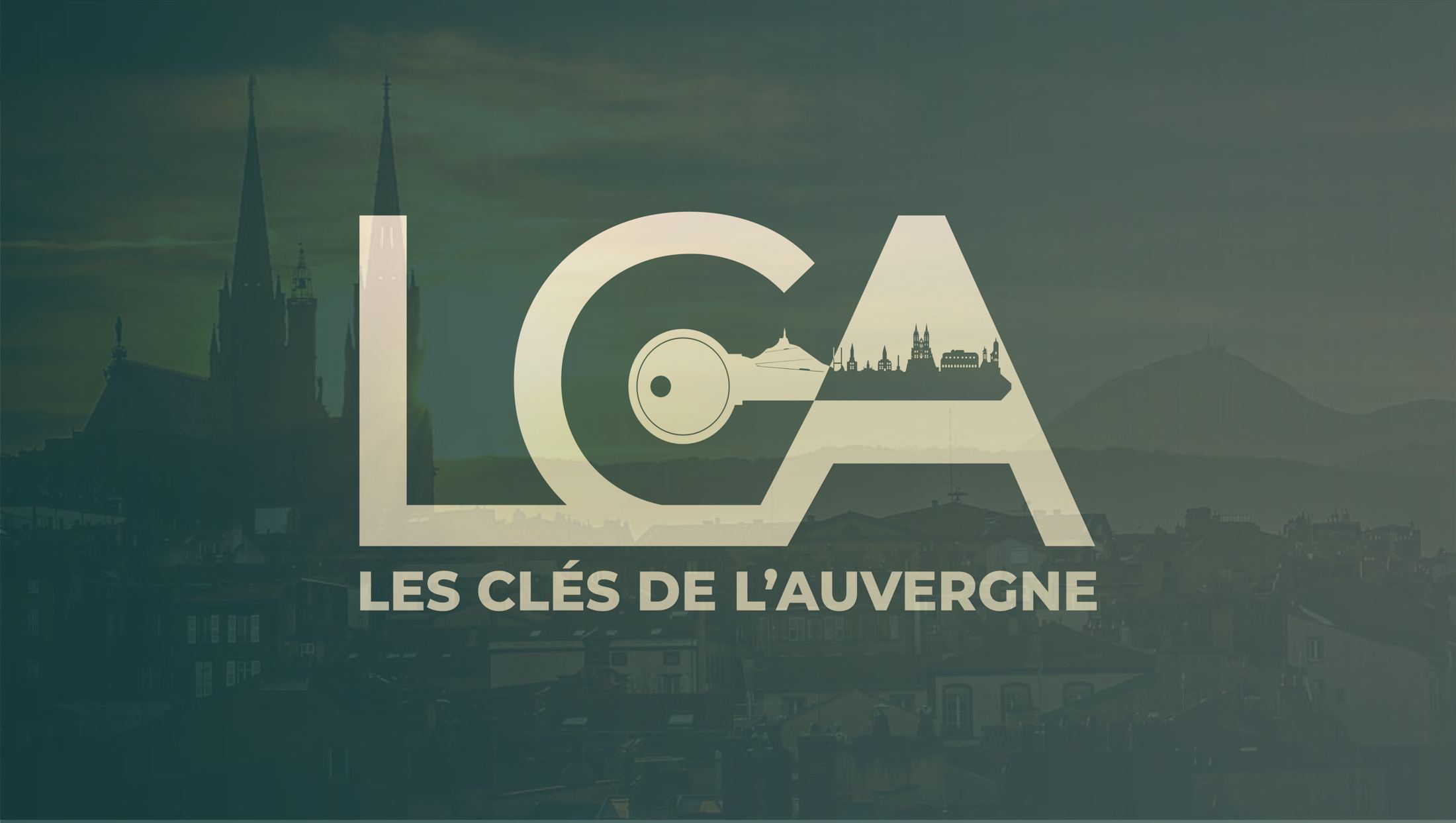 Les Clés de l’Auvergne – logo sur fond de Clermont-Ferrand et du Puy de Dôme